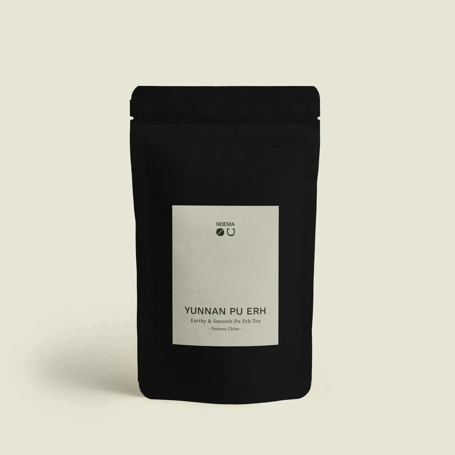 Yunnan Pu Erh - Noema - Teeverpackung von vorne fotografiert